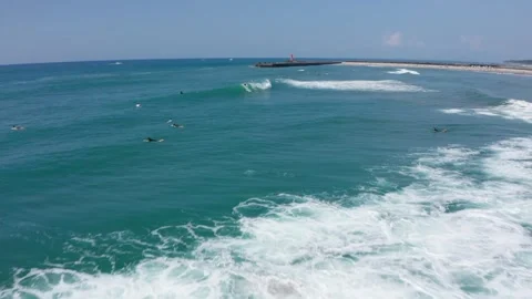 Drone flight over surfers in Aoshima Miyazaki Japan Stock Footage 259366085