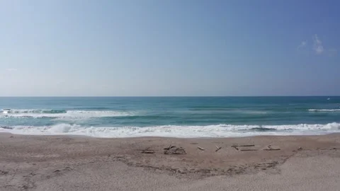 Drone flight over surfers in Aoshima Miyazaki Japan Stock Footage 259366118