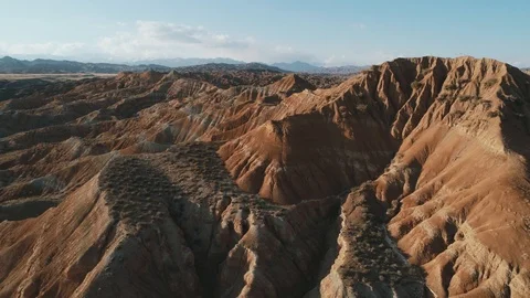 Drone flight over the Tigris Mountains, overlooking a hilly sandy valley, 4K. Stock Footage 111370853