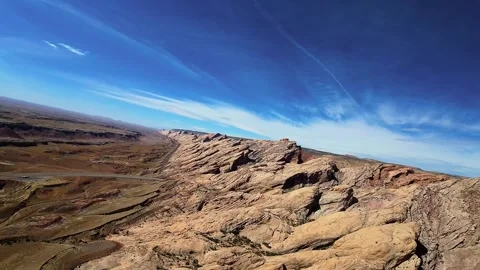 Drone flight over tilted red rock strata and dry badlands in the American West Vídeos de archivo 331769364