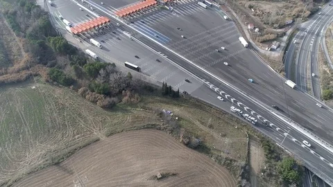 Drone flight over a toll with orange booths Stock Footage 85356378