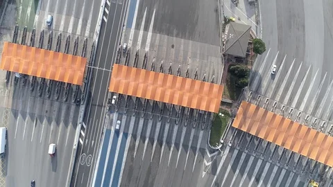 Drone flight over a toll with orange booths Stock Footage 85356498