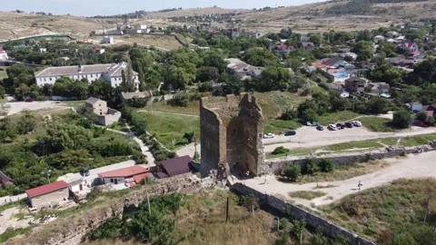 Drone flight over the Tower of ancient ruined Genoese fortress Kaffa Stock Footage 163674290