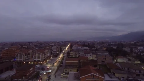 Drone flight over a town at sunset Stock Footage 71574107