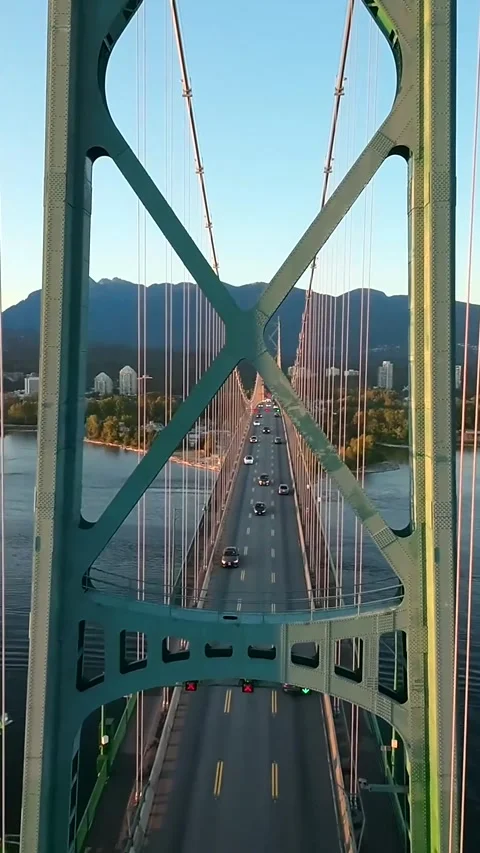 Drone flight over traffic road on Lions Gate Bridge. Vancouver, Canada Stock Footage 317718838