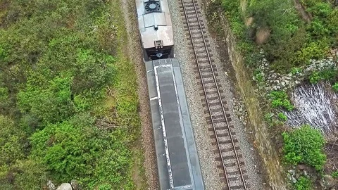 Drone flight over train arrival at the station Devil s Nose Ecuador Stock Footage 90358518