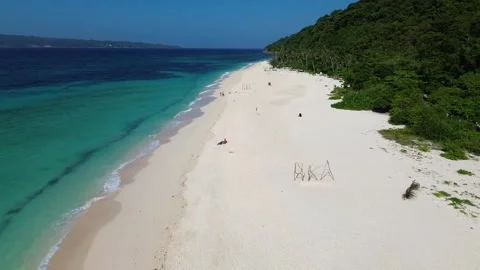 Drone flight over tropical Puka Beach coastline Boracay island clear blue oc Stock-Footage 334050071