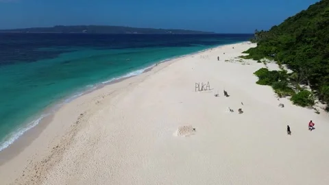 Drone flight over tropical Puka Beach coastline Boracay island clear blue oc Stock Footage 334050072