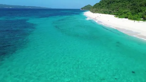 Drone flight over tropical Puka Beach coastline Boracay island clear blue oc Stock Footage 334050104
