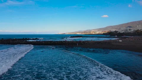 Drone flight over the Troya beach Tenerife, Playa de las Americas. Stock Footage 228967745