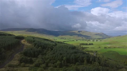 Drone flight over typical Scottish forestry and farmland. Stock Footage 346244525