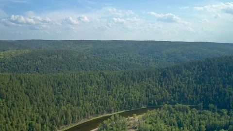 Drone flight over the valley with a decline to the river. Stock Footage 114879653