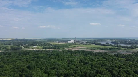 Drone flight over a vast forest landscape with a distant city. Stock Footage 312591096