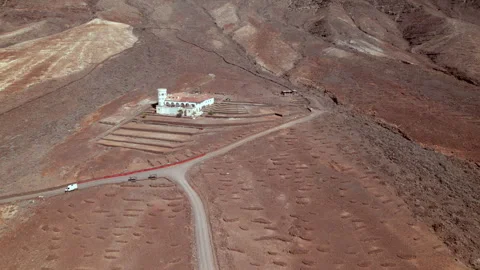 Drone flight over Villa Winter and coastline of Cofete in Fuerteventura Stock Footage 309859123