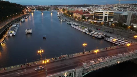 Drone flight over the Vltava river and bridges with lanterns and car traffic Stock Footage 256161492