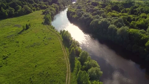Drone flight over water and trees from a height Stock Footage 197472099