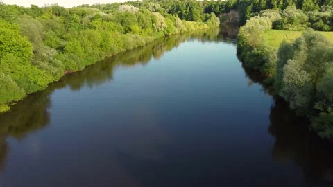 Drone flight over water and trees from a height Stock Footage 197472325