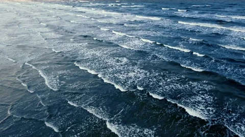 Drone flight over wavy deep blue sea 스톡 동영상 234403258