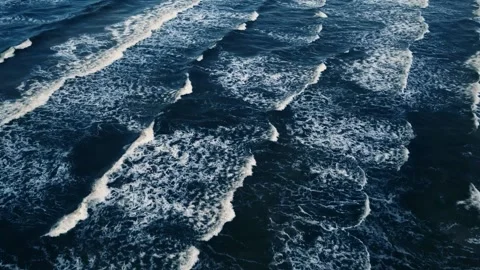 Drone flight over wavy deep blue sea 스톡 동영상 234403830