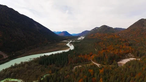 Drone flight over a wide mountain valley with river and autumn forests Stock Footage 296582264