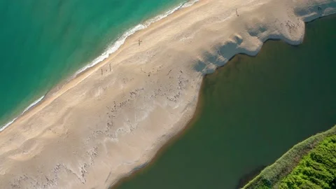 Drone flight over a wild sandy beach between river and sea Stock Footage 146171668