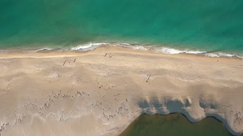 Drone flight over a wild sandy beach between river and sea Stock Footage 146171950