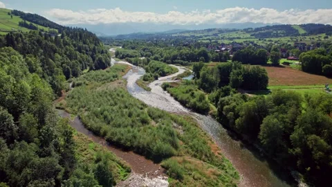 Drone Flight Over a Winding River Towards a Picturesque European Village 库存影片 314346163