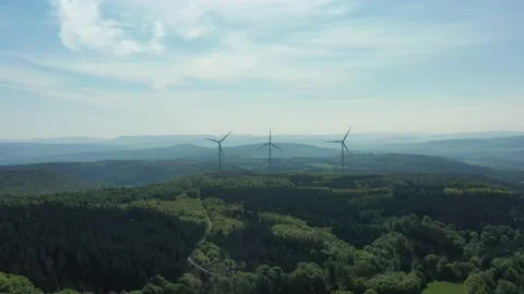 Drone flight over windmills in Lower Saxony landscape, Germany Видео 134405777