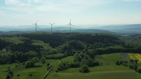 Drone flight over windmills in Lower Saxony landscape, Germany Видео 134405806