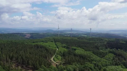 Drone flight over windmills in Lower Saxony landscape, Germany Stock Footage 134409156