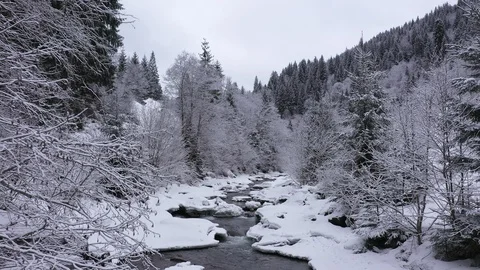 Drone flight over winter brook at Carpathian Mountains, 4k Stock Footage 119890371