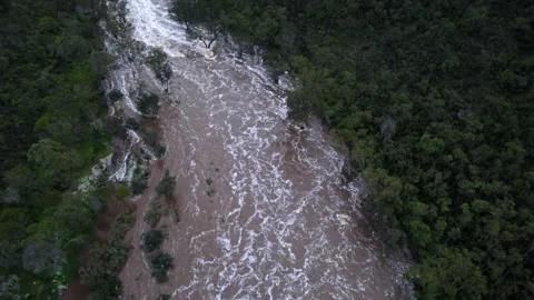 Drone flight pan upwards above rapids and flooded river Stock Footage 161137550