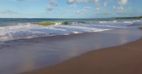 Drone flight parallel to shoreline over waves tropical beach Panama Vídeos de archivo 332611061