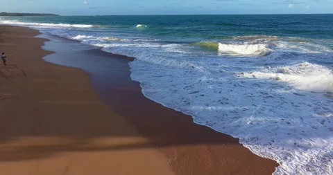 Drone flight parallel to shoreline over waves tropical beach Panama Vídeos de archivo 332611150