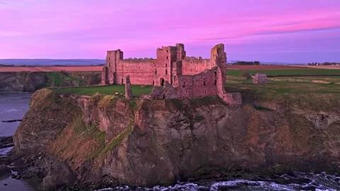 Drone Flight Past Ancient Castle Ruins on a Cliff at Pink Sunset Stock-Footage 341209447