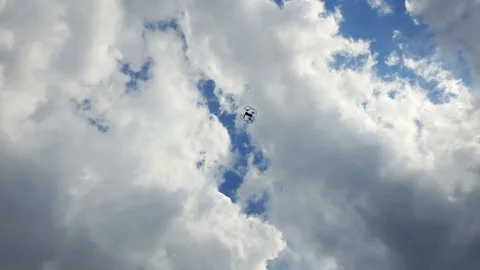 Drone flight record from bottom in a blue sky with clouds Stock Footage 129617888