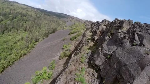 Drone flight by rock wall 動画素材 224160621