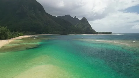 Drone flight rounding Tunnels Beach to reveal Bali Hai, Kauai, Hawaii Stock Footage 299962797