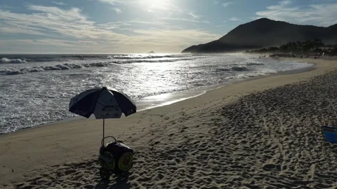 Drone Flight from Sandy Beach Toward Rolling Ocean Waves Stock Footage 340530676