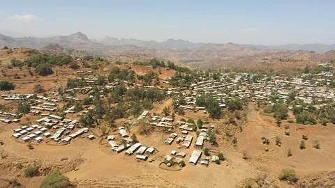 Drone flight small town mountains in Tigray region Ethiopia Stock Footage 114395523