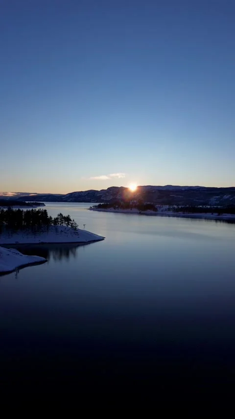 Drone flight, straight towards the sun. End of winter Norway Stock-Footage 319476260