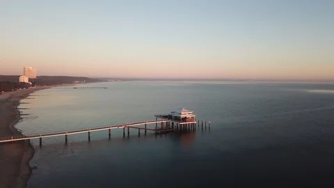 DRONE FLIGHT AT SUNRISE ON THE BEACH Stock Footage 112149224