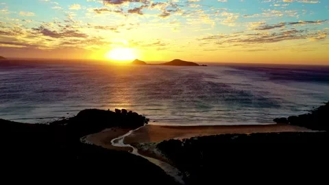 Drone flight on a sunset beach in Queensland, AU, surfing the waves Stock Footage 262953304
