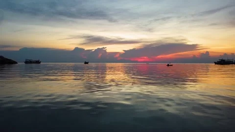 Drone Flight at Sunset with Kayak and Boats Silhouettes Koh Tao Stockbeeldmateriaal 331867287