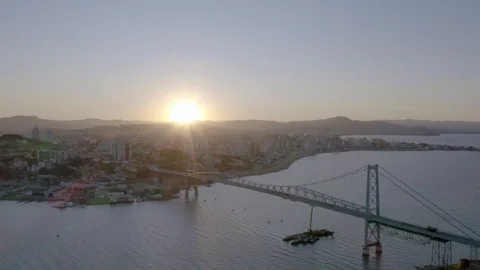 Drone flight at sunset over the Hercilio Luz bridge in Florianopolis, Santa Stock Footage 129321888