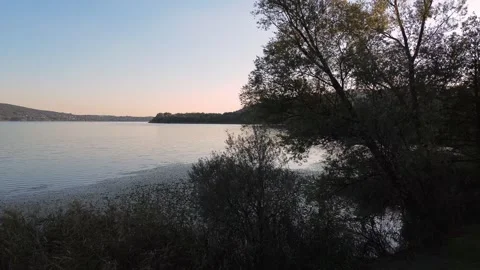 Drone flight at sunset over Lake Comabbio Stock Footage 318556696