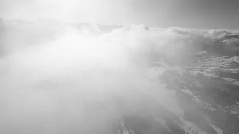 A drone flight in the Swiss mountains through the fog Video stock 100599253