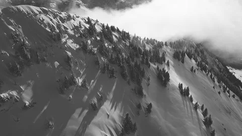 A drone flight in the Swiss mountains through the fog Video stock 100600696