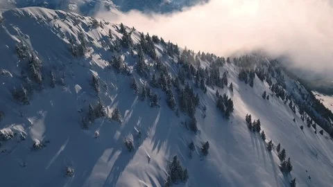 A drone flight in the Swiss mountains through the fog Video stock 100600756