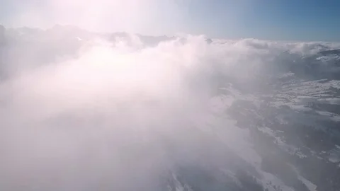A drone flight in the Swiss mountains through the fog Stock-Footage 100601006